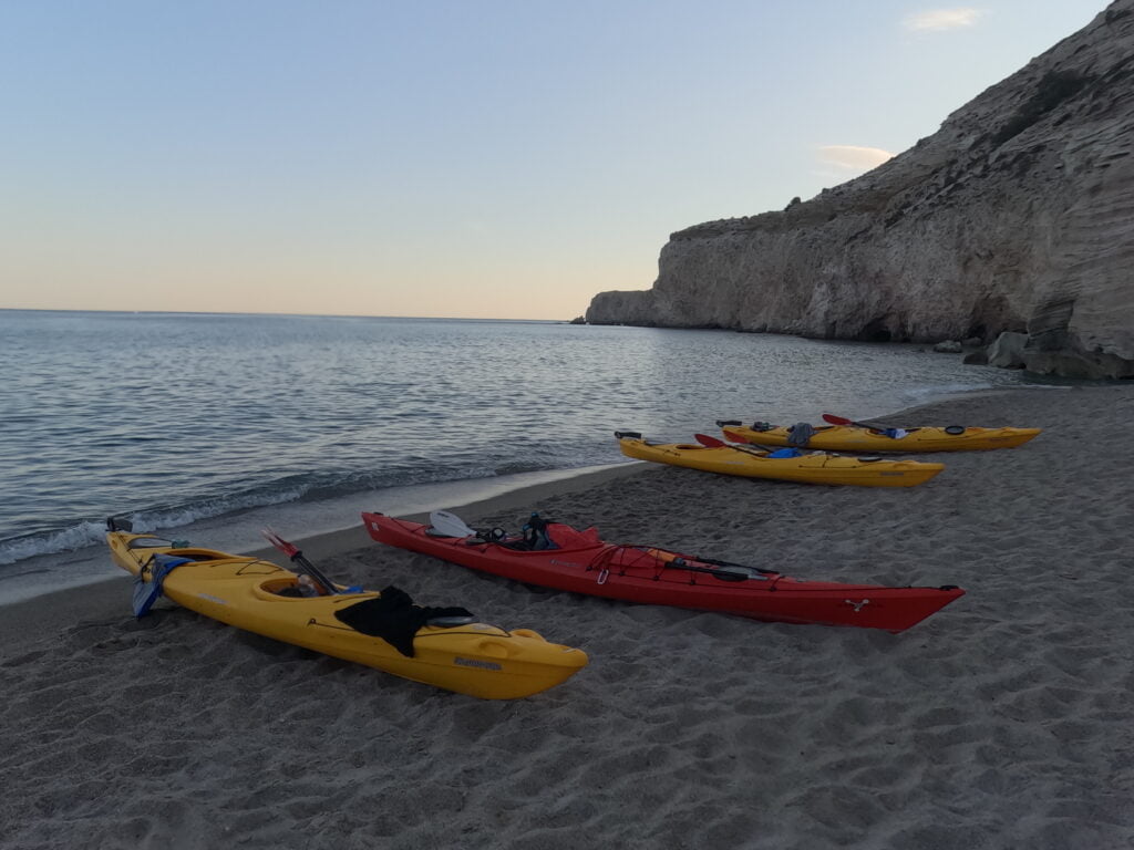 a group of kayaks on a gerakas beach milos greece